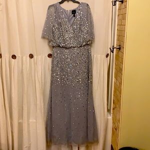 Silver gown with flutter sleeves and sequins
